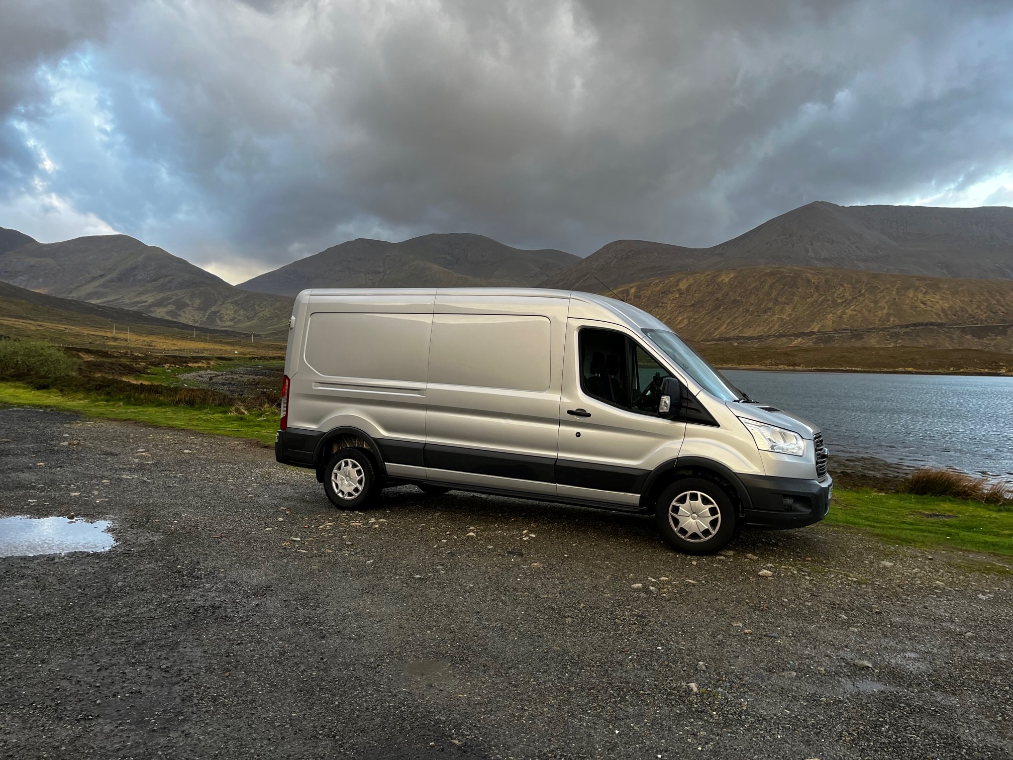 The original Silver Lady van, YR18 UCF, against the Isle of Skye landscape